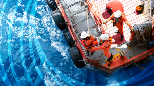 Day of the Seafarer 2025 - My Harassment-Free Ship. Image of cargo ship from above, man in orange jumpsuit working on the ship.